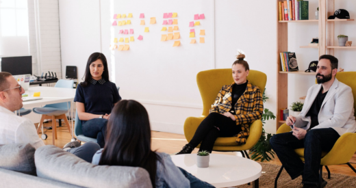 diverse colleagues having conversation at work